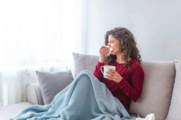 Sick desperate woman has flu.